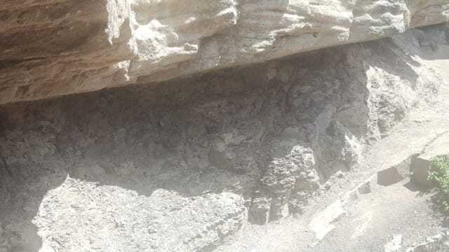 Differential weathering...sandstone above shale