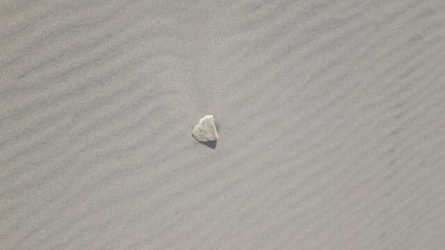 Deposition behind an obstruction